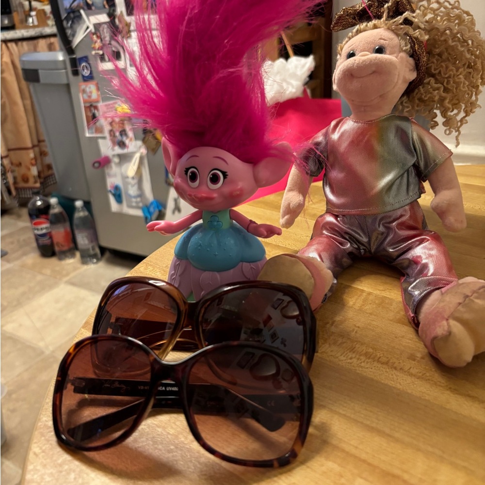 Two Pairs of Sunglasses and Troll Doll